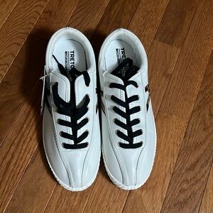 A brand new pair of leopard Treton tennis shoes